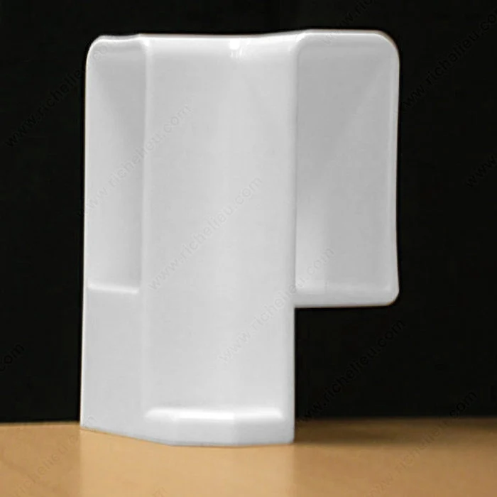 Pièce d'angle pour moulure de contour à recouper